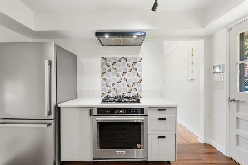 4940 3rd Street Verona, PA 15147 - Photo 13 of 27 a kitchen with stainless steel appliances a stove and a refrigerator