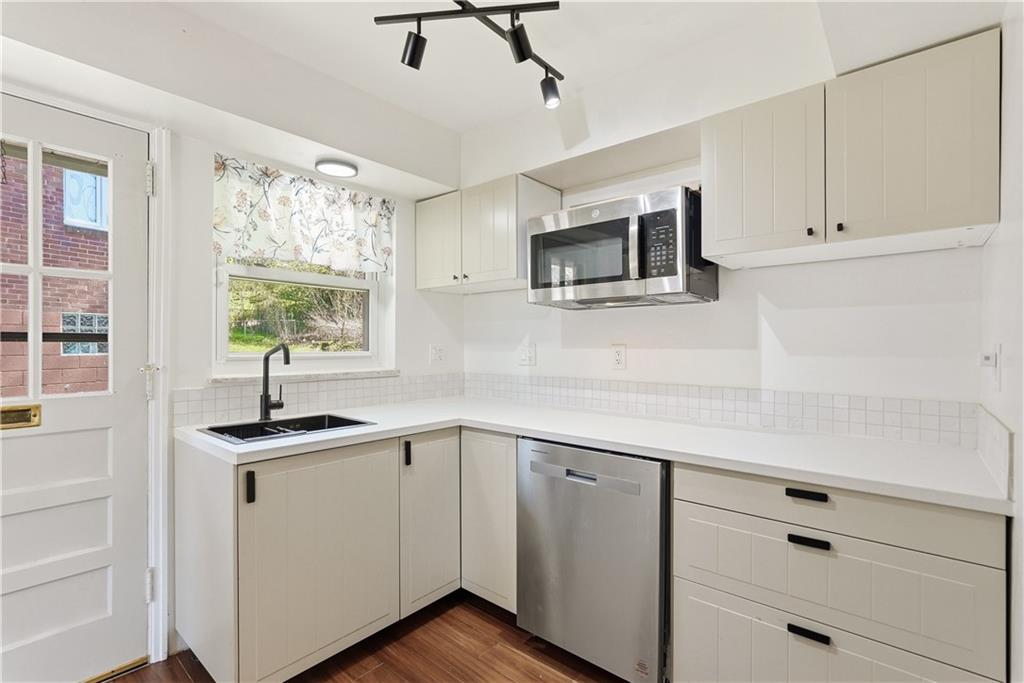 4940 3rd Street Verona, PA 15147 - Photo 15 of 27 a kitchen with a sink and cabinets