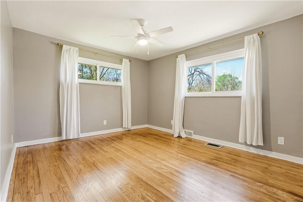 4940 3rd Street Verona, PA 15147 - Photo 19 of 27 a view of an empty room with wooden floor and a window