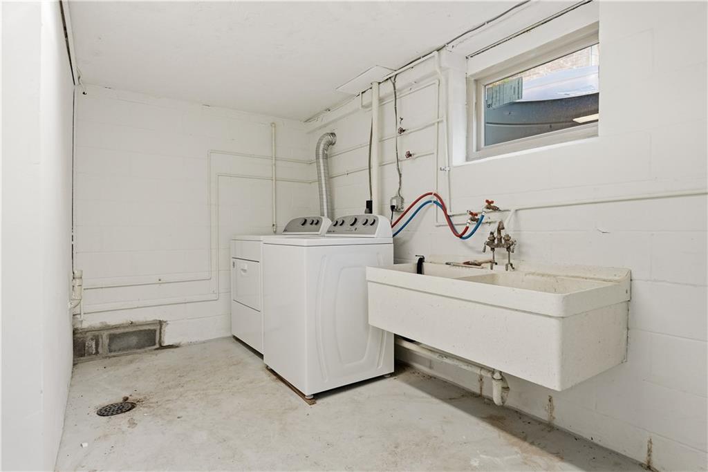 4940 3rd Street Verona, PA 15147 - Photo 23 of 27 a bathroom with a sink and a mirror