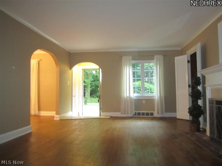 829 Bryce Road Kent, OH 44240 - Photo 12 of 24 Living room has wood burning fireplace.
