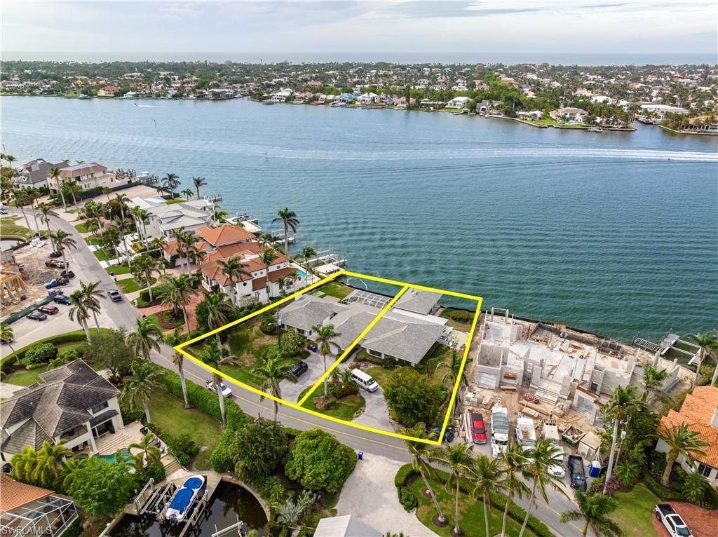 1900 Kingfish Road Naples, FL 34102 - Photo 6 of 11 an aerial view of a house with a lake view