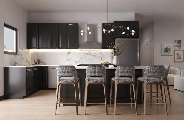 a kitchen with granite countertop cabinets and chairs