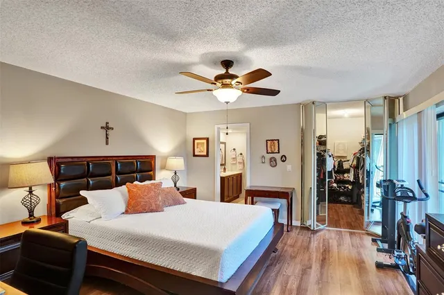 a bed room with a bed and a chandelier