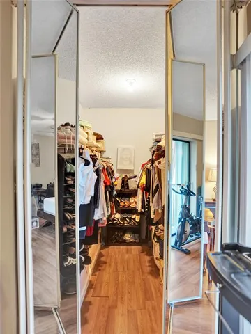 a view of a living room with furniture and a window
