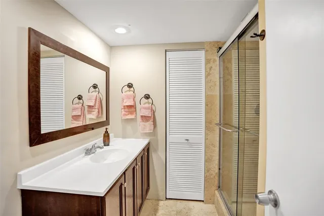 a bathroom with a sink and a mirror