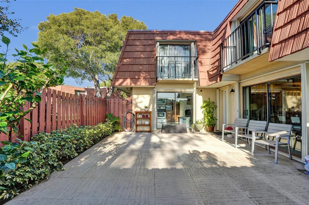 1525 Augusta Circle, Unit 109 Delray Beach, FL 33445 - Photo 2 of 23 a view of a building with a yard