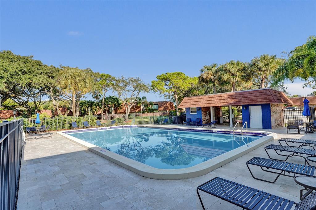 1525 Augusta Circle, Unit 109 Delray Beach, FL 33445 - Photo 21 of 23 swimming pool view with a seating space