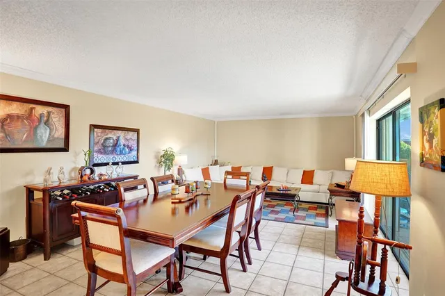 a dining room with a table and chairs