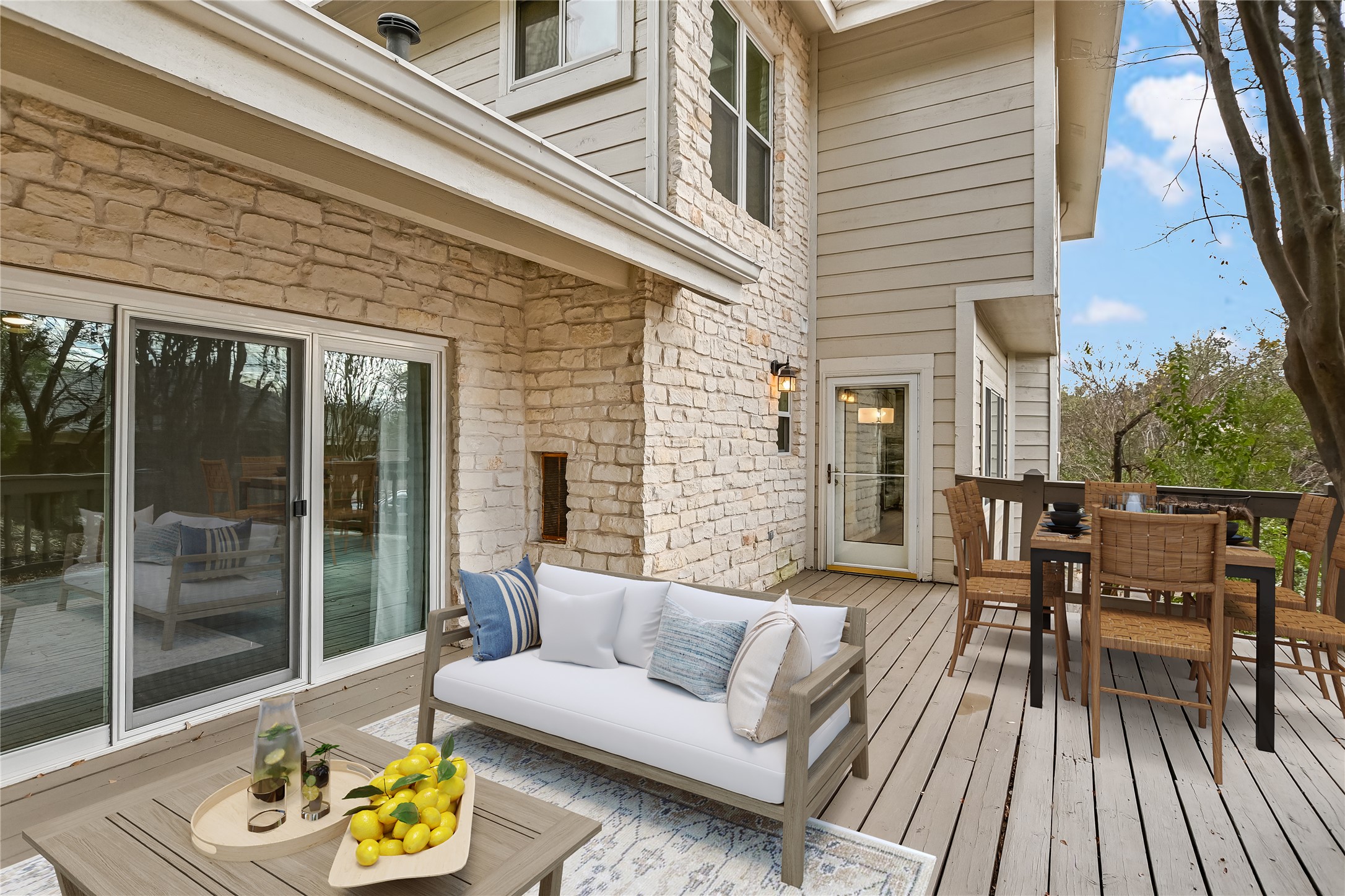 4906 Bob Cat Run Austin, TX 78731 - Photo 25 of 40 a view of a patio with couches and a dining table and chairs with wooden floor