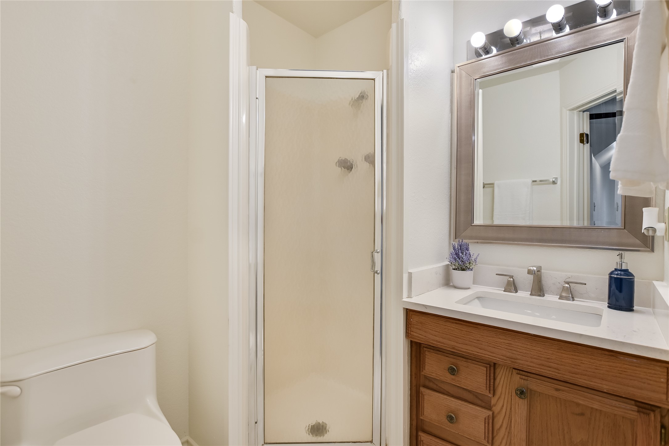 4906 Bob Cat Run Austin, TX 78731 - Photo 29 of 40 a bathroom with a sink and a mirror