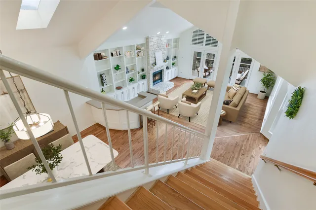 a view of living room with furniture and fireplace