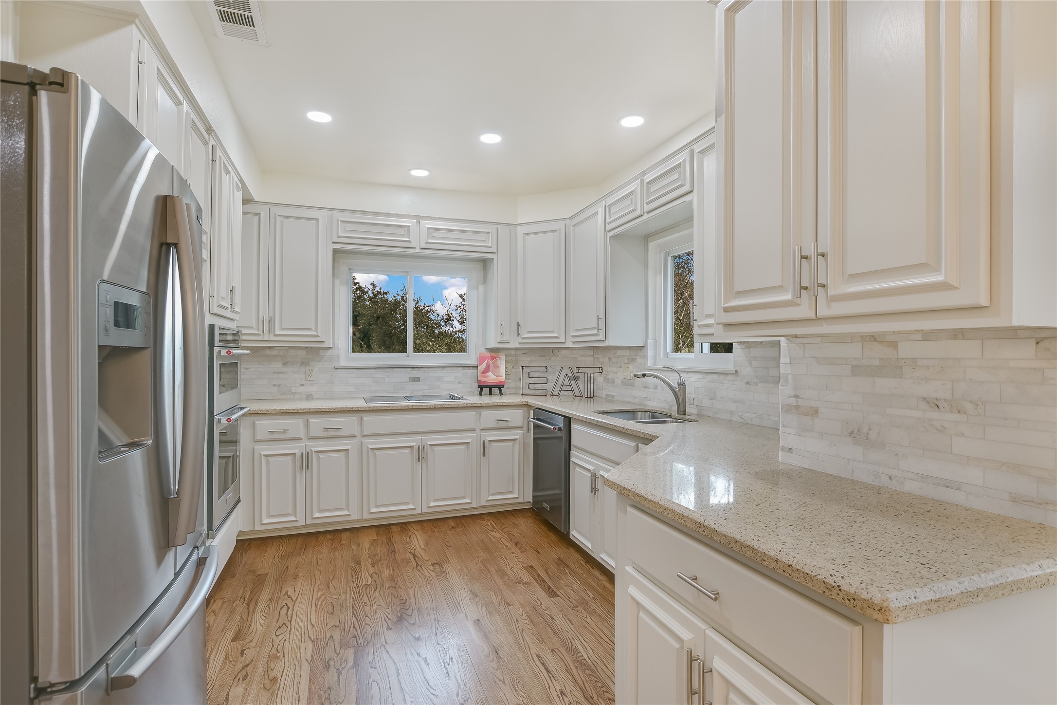 4906 Bob Cat Run Austin, TX 78731 - Photo 10 of 40 a kitchen with a sink stove and refrigerator