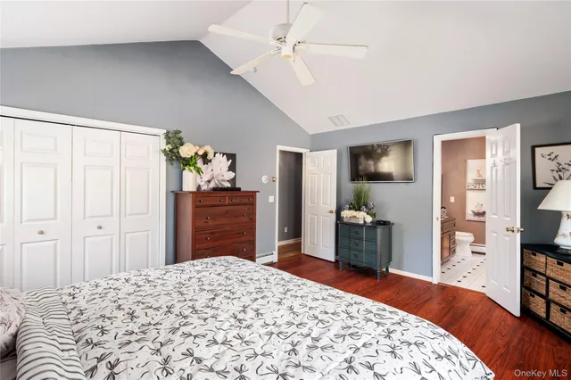 a bedroom with a bed and a dresser in it