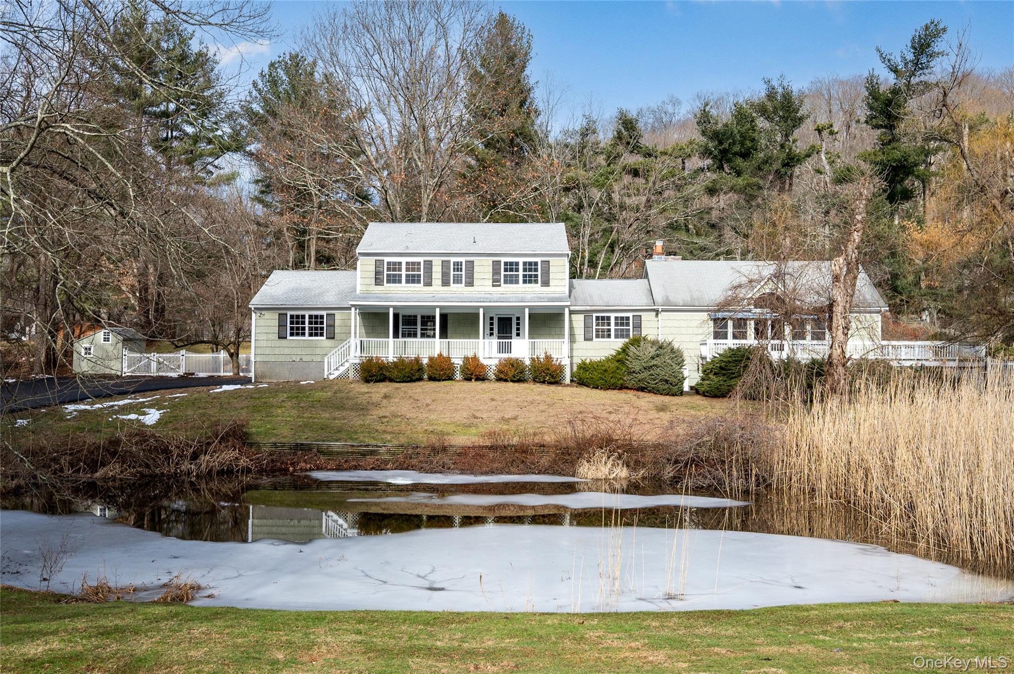 58 Millbrook Road Bedford, NY 10506 - Photo 27 of 41 a view of a house with swimming pool and sitting area