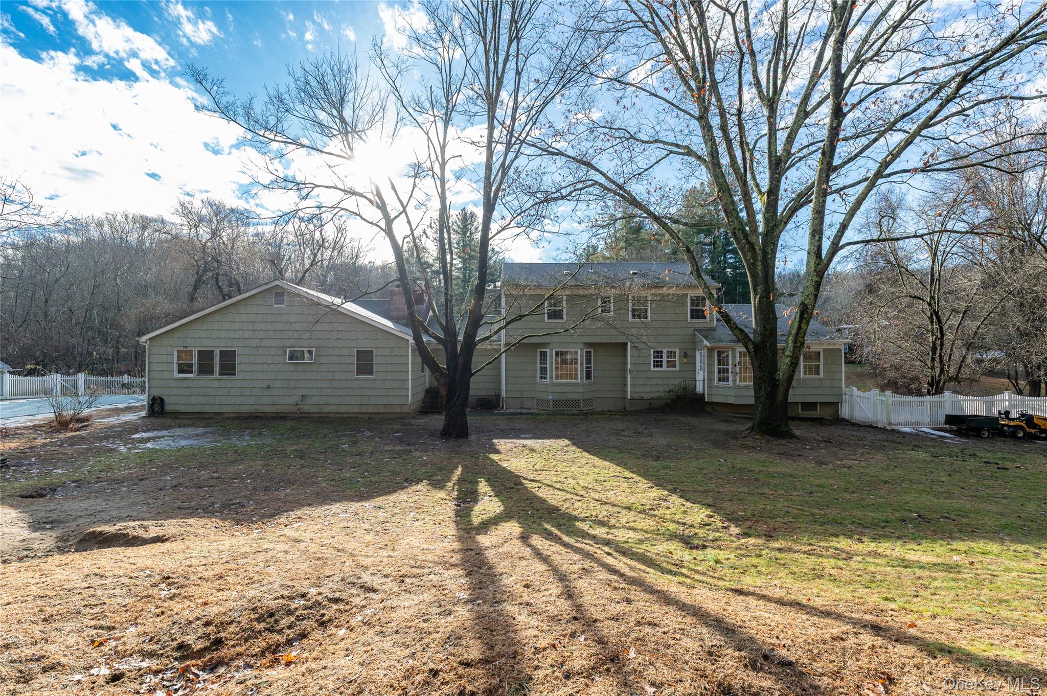 58 Millbrook Road Bedford, NY 10506 - Photo 32 of 41 a view of a large house with a large tree in it
