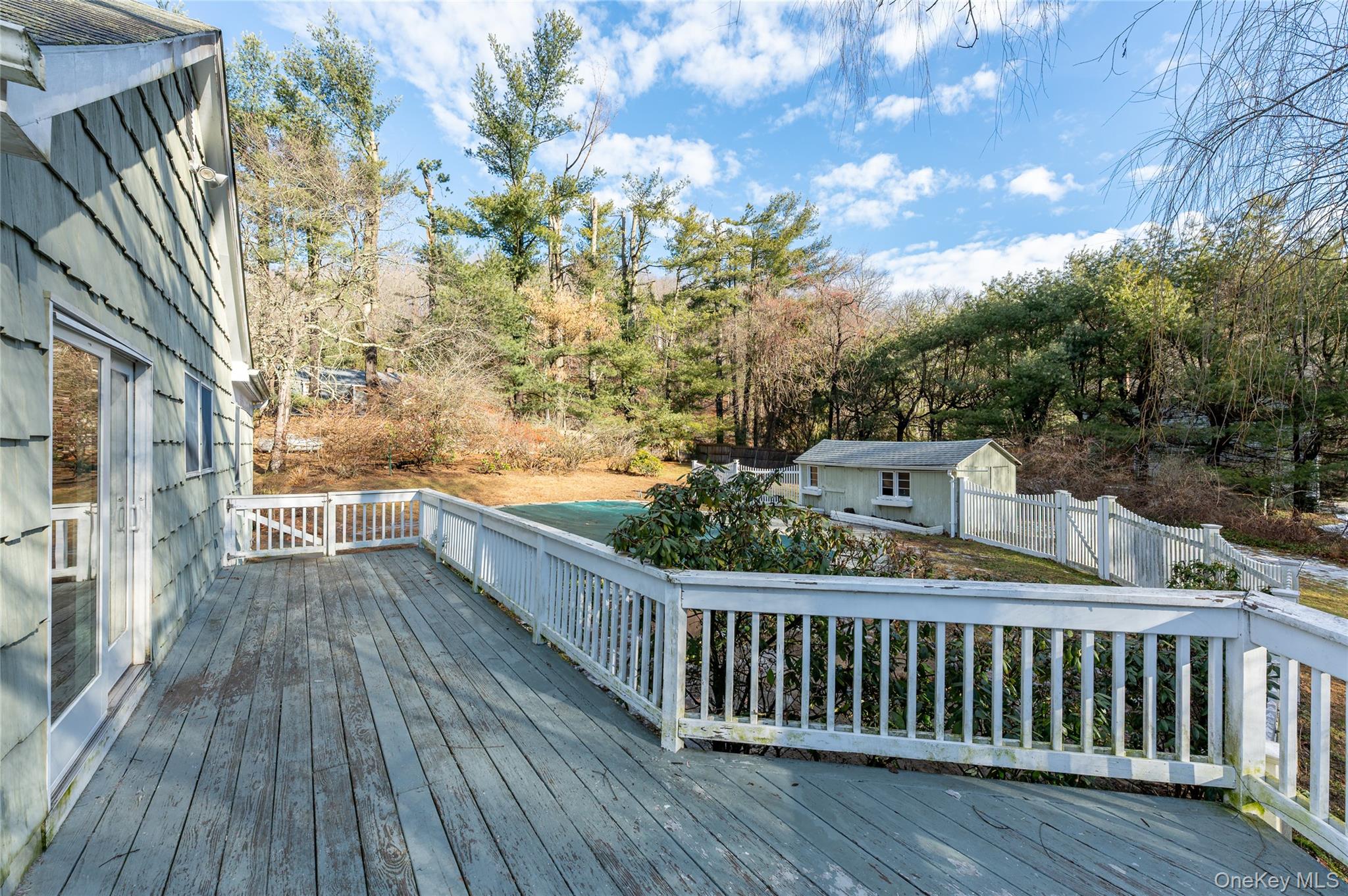 58 Millbrook Road Bedford, NY 10506 - Photo 35 of 41 a view of balcony with wooden floor and fence