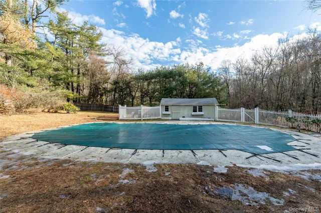 a view of balcony with wooden floor and fence
