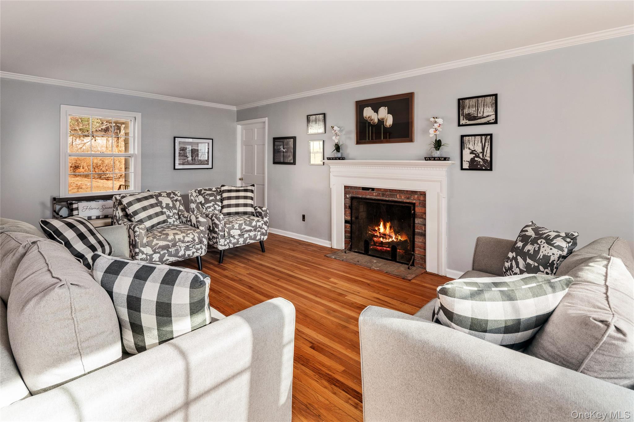 58 Millbrook Road Bedford, NY 10506 - Photo 8 of 41 a living room with furniture and a fireplace
