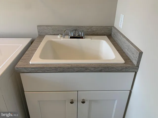 a view of storage and utility room with washer and dryer