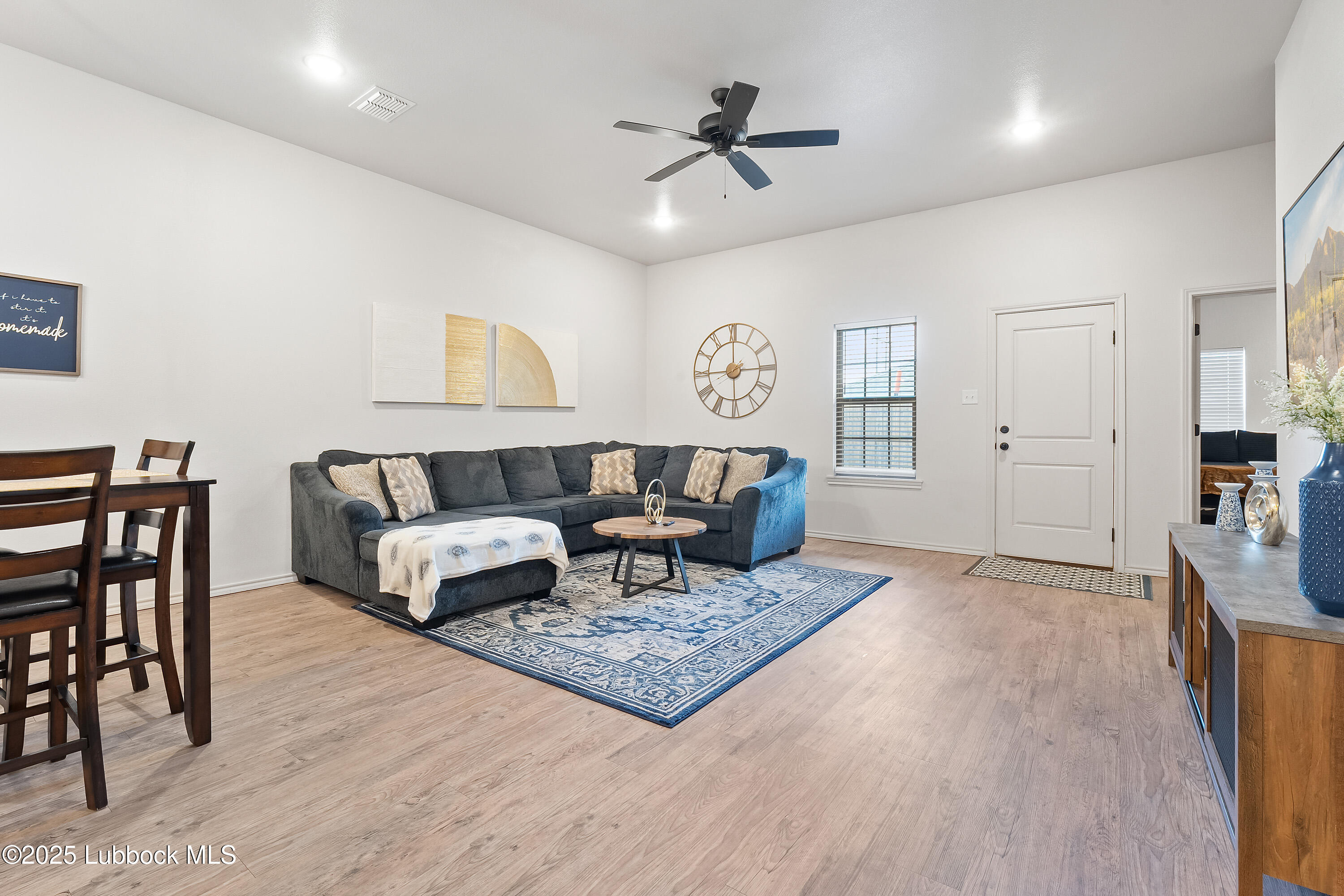5528 Lehigh Street Lubbock, TX 79416 - Photo 6 of 23 a living room with furniture and a rug