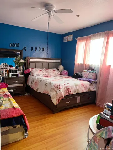 a bedroom with bed and window