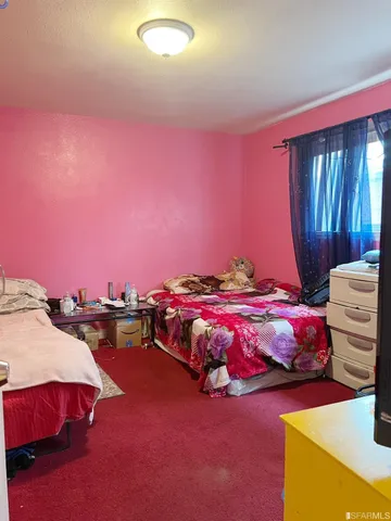 a bedroom with a bed and a closet