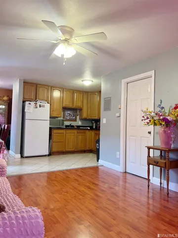 a view of kitchen with furniture and wooden floor