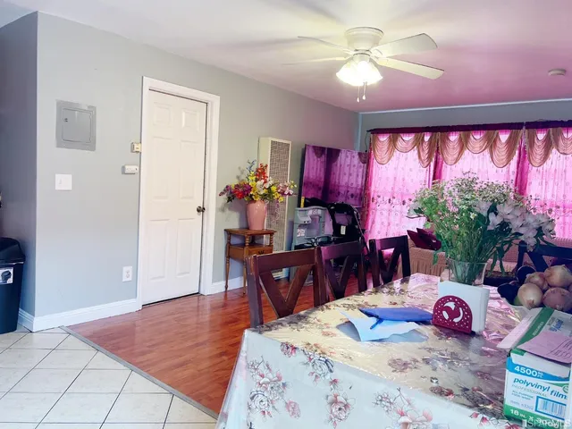 a view of a dining room with furniture and chandelier