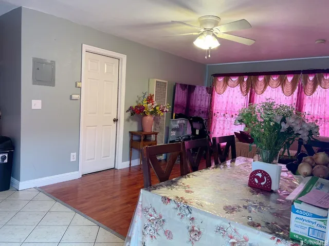 a view of a dining room with furniture and chandelier