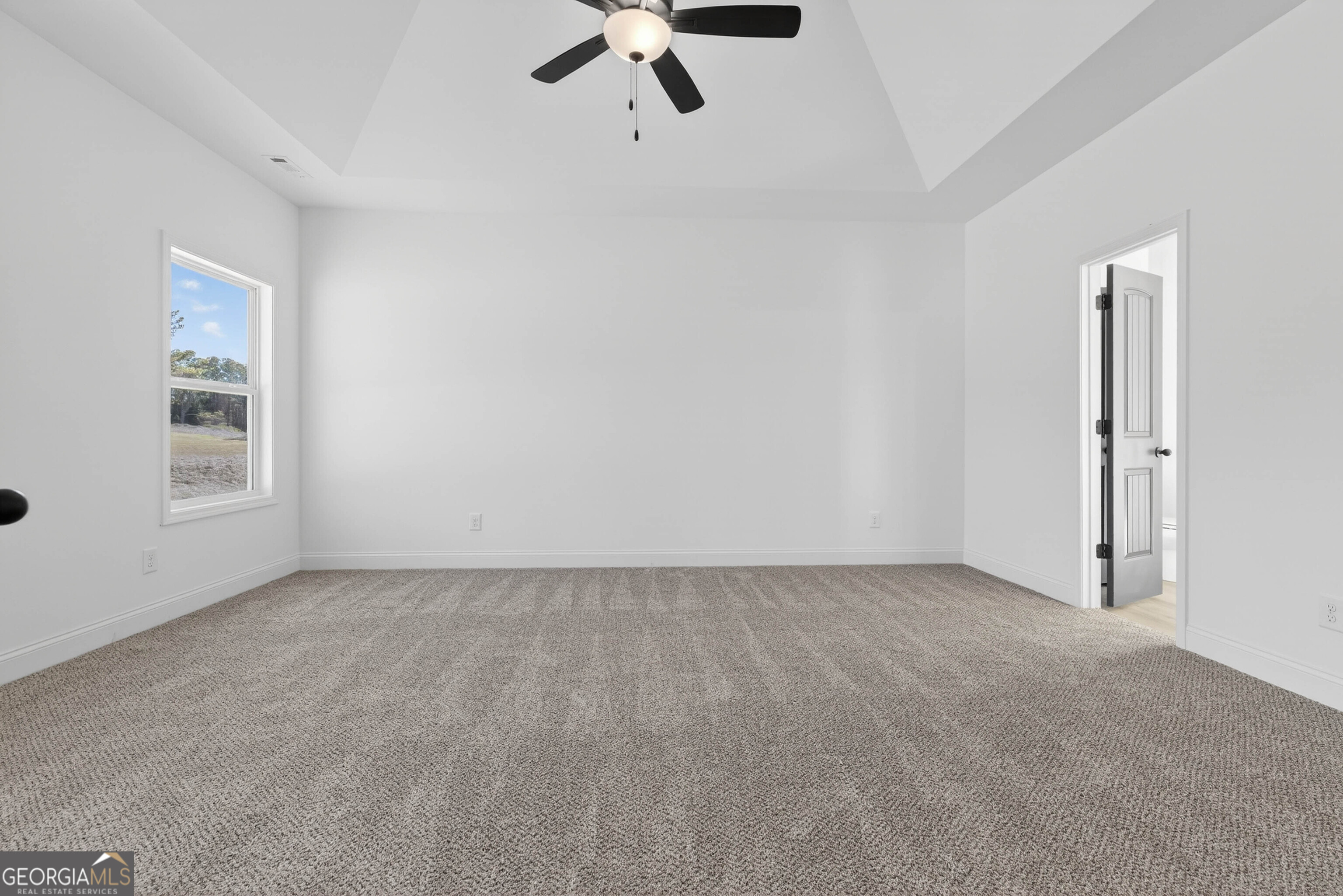 707 Oakmont Trail Villa Rica, GA 30180 - Photo 13 of 33 a view of an empty room with a window