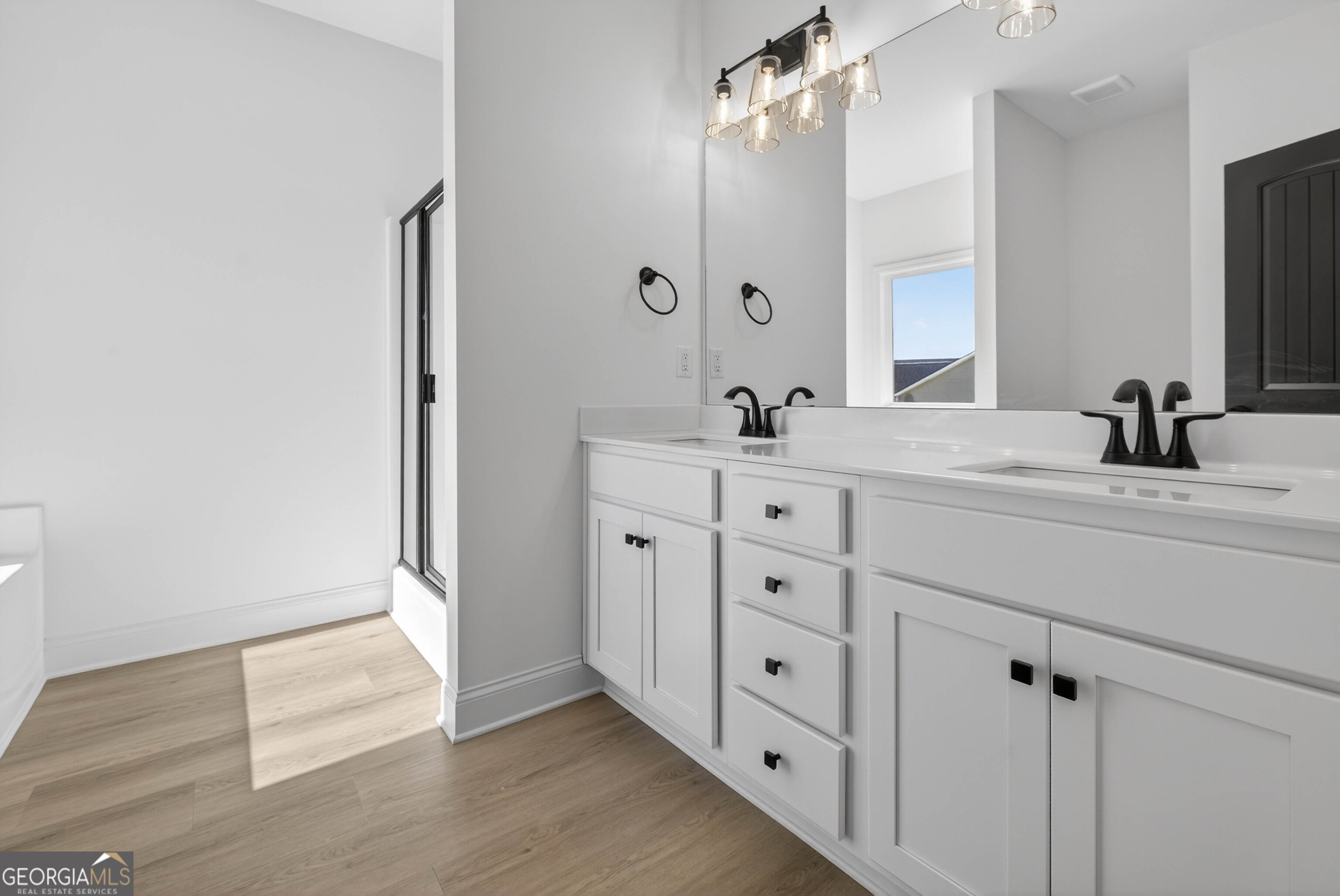 707 Oakmont Trail Villa Rica, GA 30180 - Photo 16 of 33 a bathroom with a double vanity sink and mirror