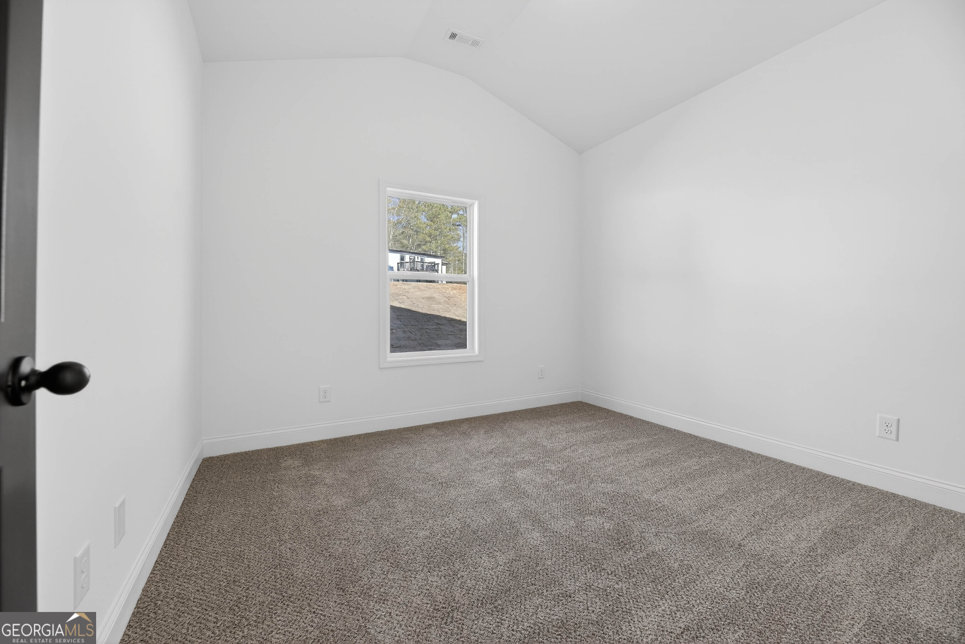 707 Oakmont Trail Villa Rica, GA 30180 - Photo 22 of 33 an empty room with a window