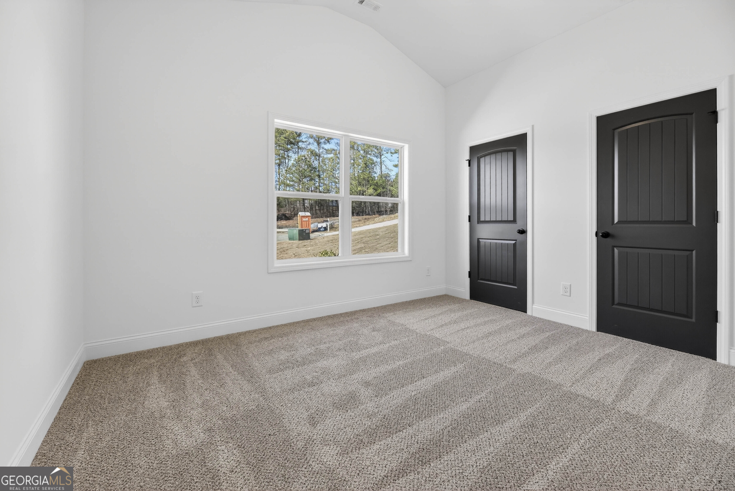 707 Oakmont Trail Villa Rica, GA 30180 - Photo 23 of 33 a view of an empty room with a window
