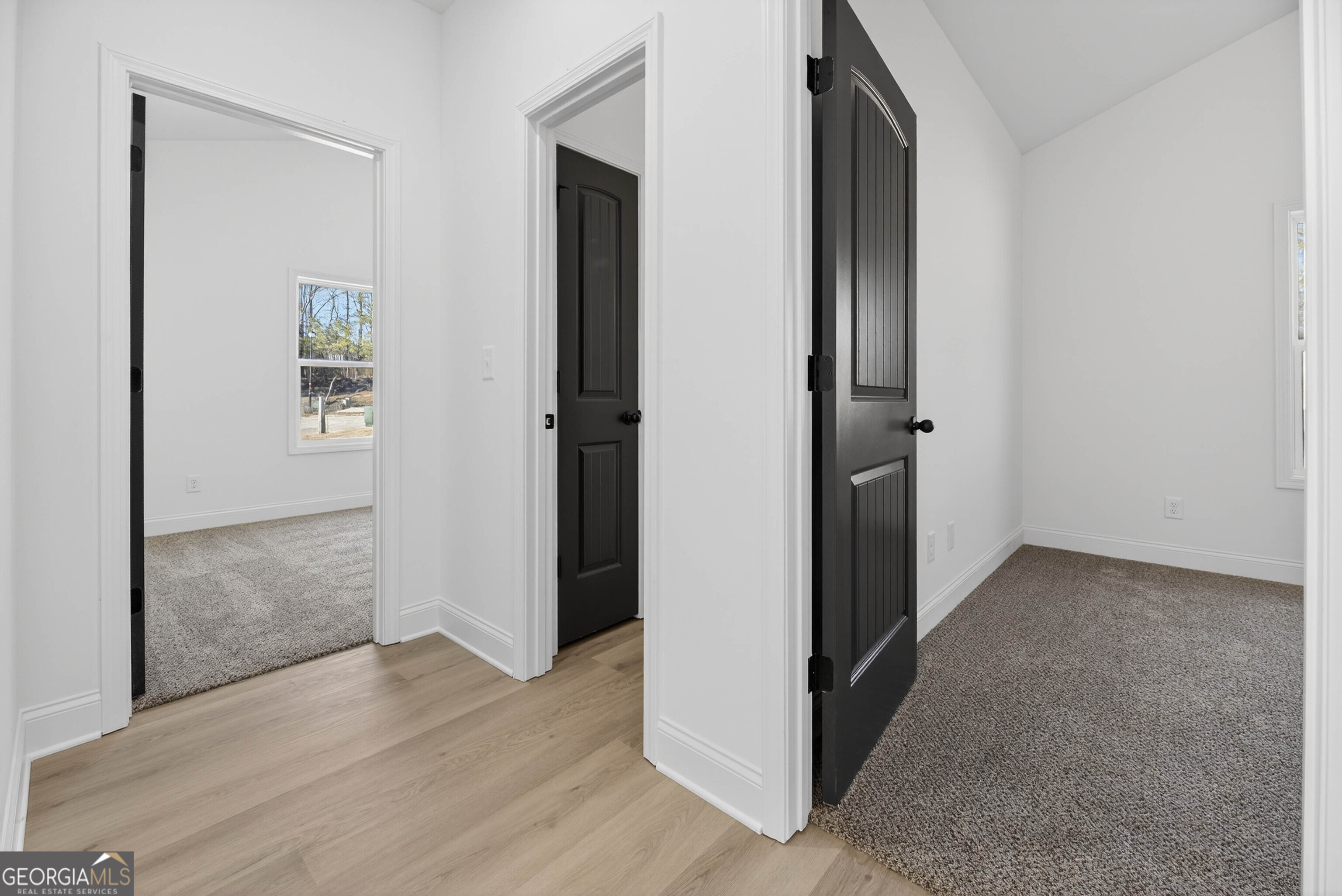 707 Oakmont Trail Villa Rica, GA 30180 - Photo 24 of 33 an empty room with wooden floor and closet