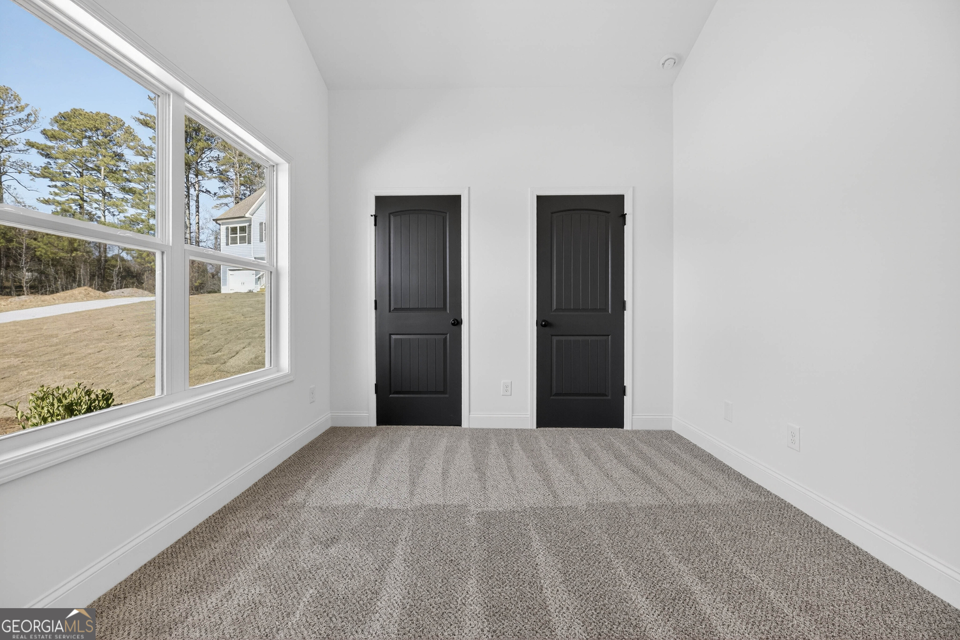 707 Oakmont Trail Villa Rica, GA 30180 - Photo 25 of 33 a view of an empty room with a window