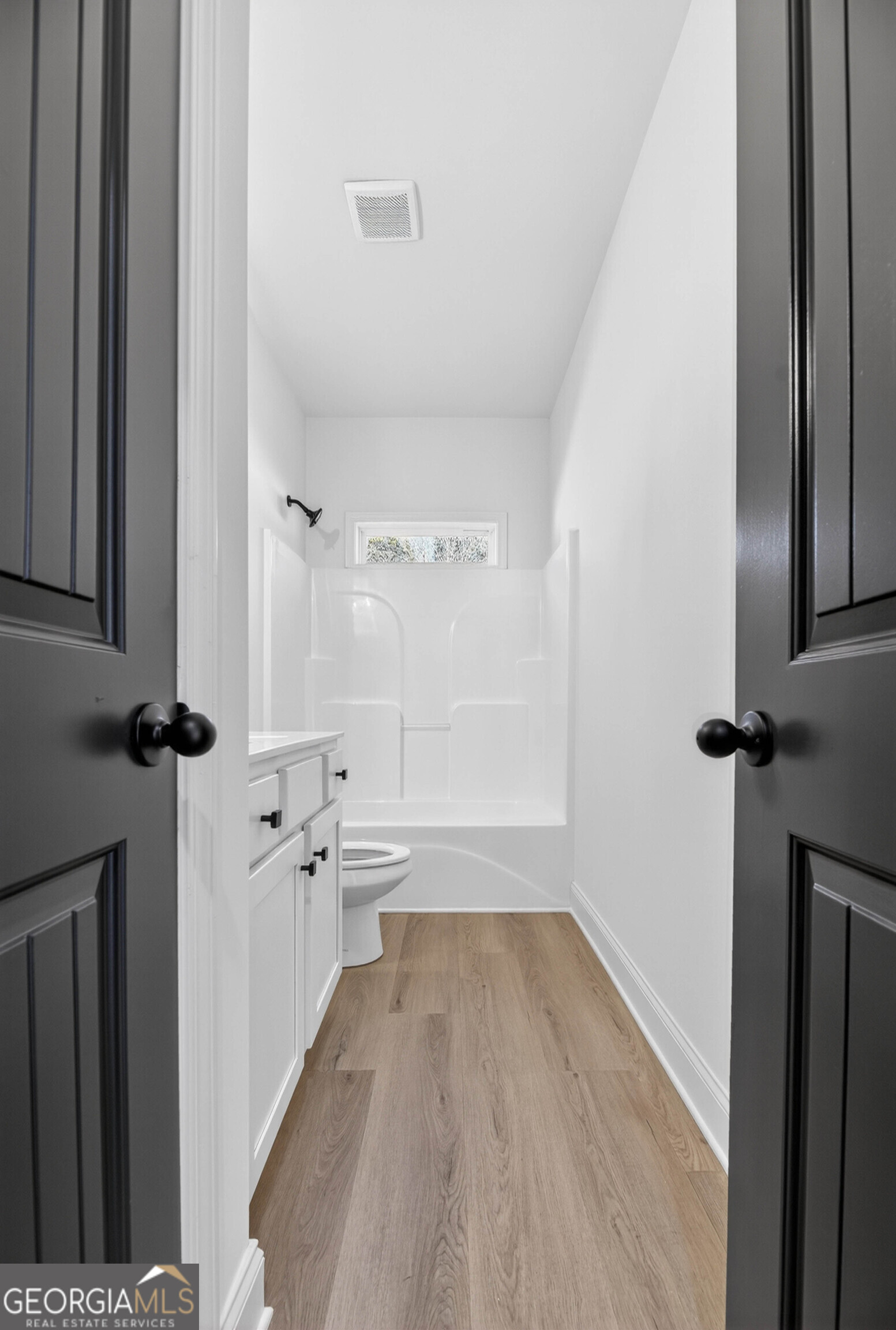 707 Oakmont Trail Villa Rica, GA 30180 - Photo 26 of 33 a view of bathroom with bathtub wooden floor and windows