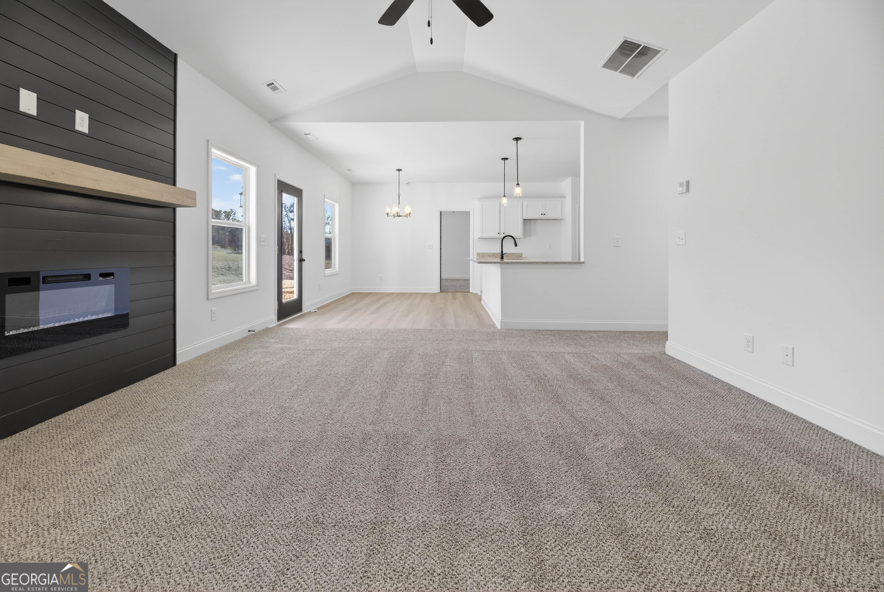707 Oakmont Trail Villa Rica, GA 30180 - Photo 3 of 33 a view of a livingroom with an empty space and a fireplace