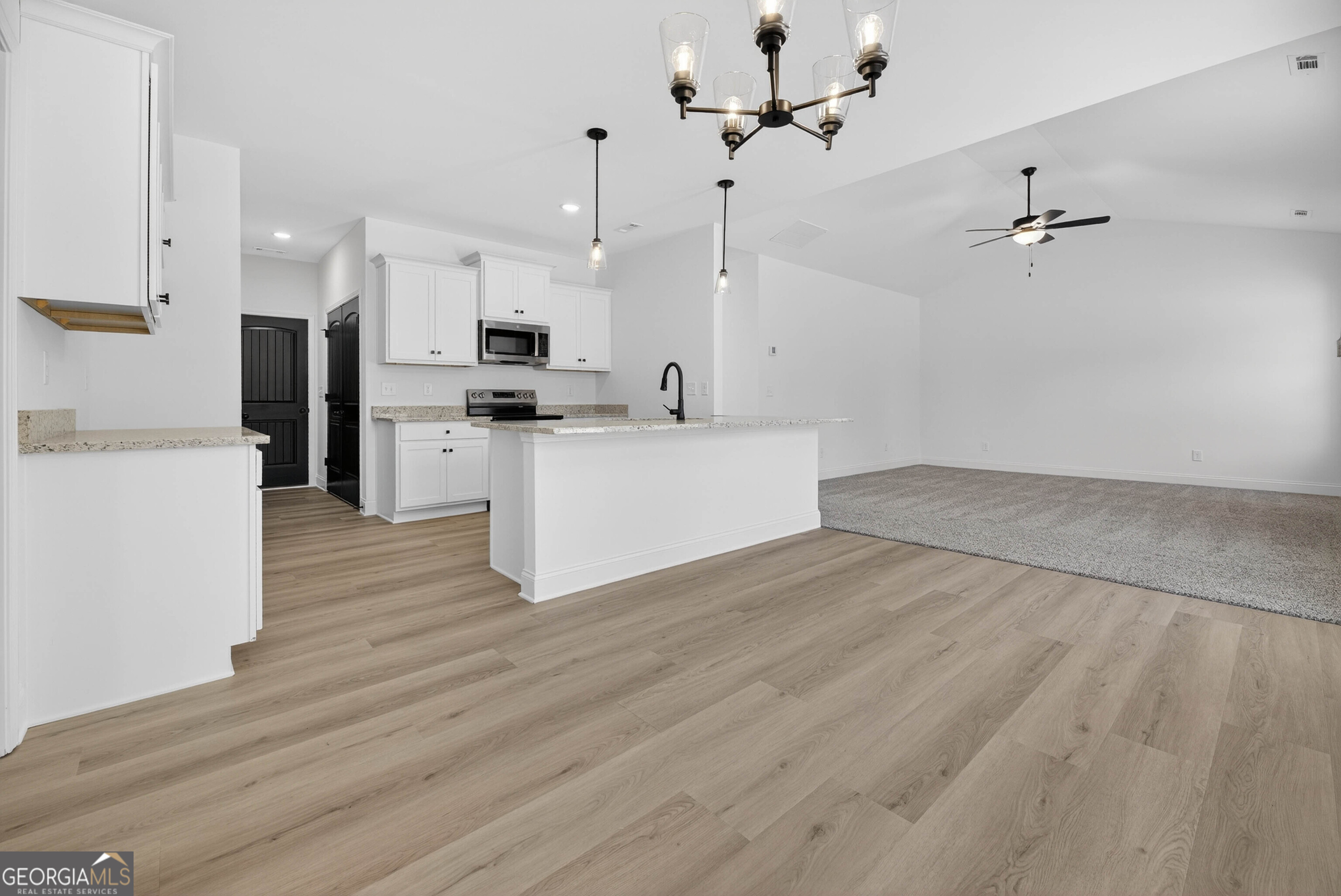 707 Oakmont Trail Villa Rica, GA 30180 - Photo 7 of 33 a view of a kitchen with wooden floor
