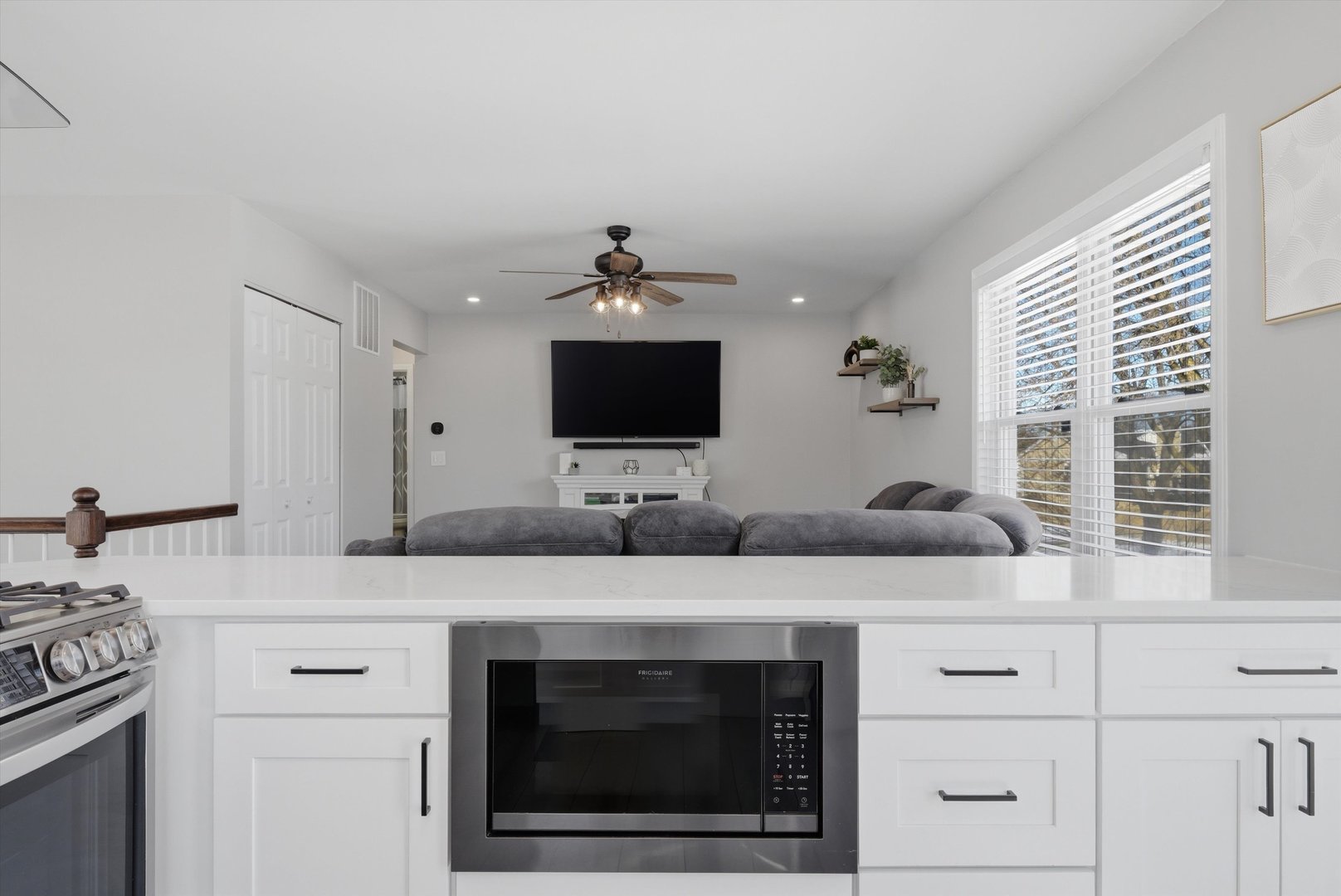 396 Nantucket Court Bartlett, IL 60103 - Photo 11 of 36 a kitchen with stainless steel appliances granite countertop a sink and a microwave