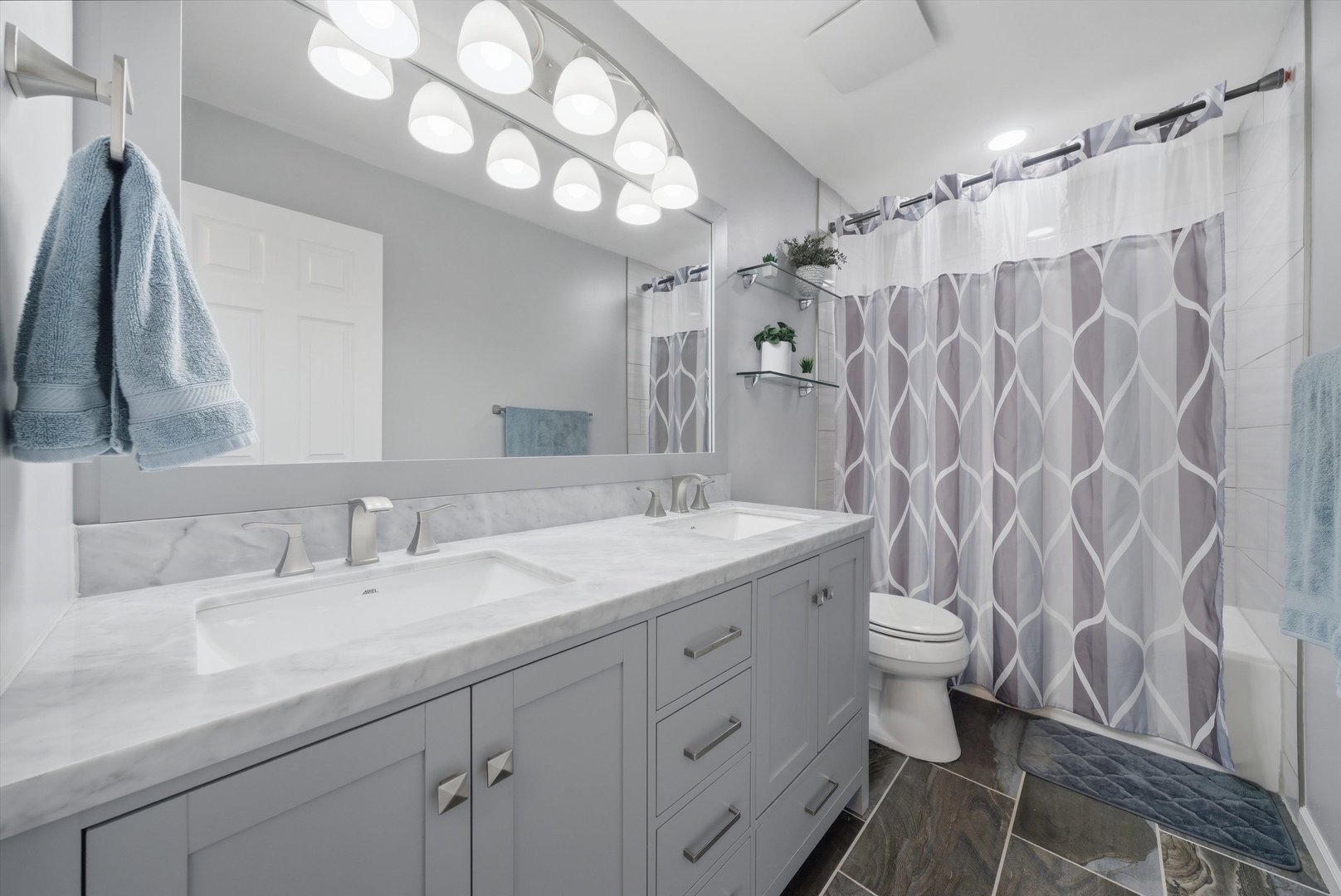 396 Nantucket Court Bartlett, IL 60103 - Photo 16 of 36 a bathroom with a double vanity sink toilet and shower