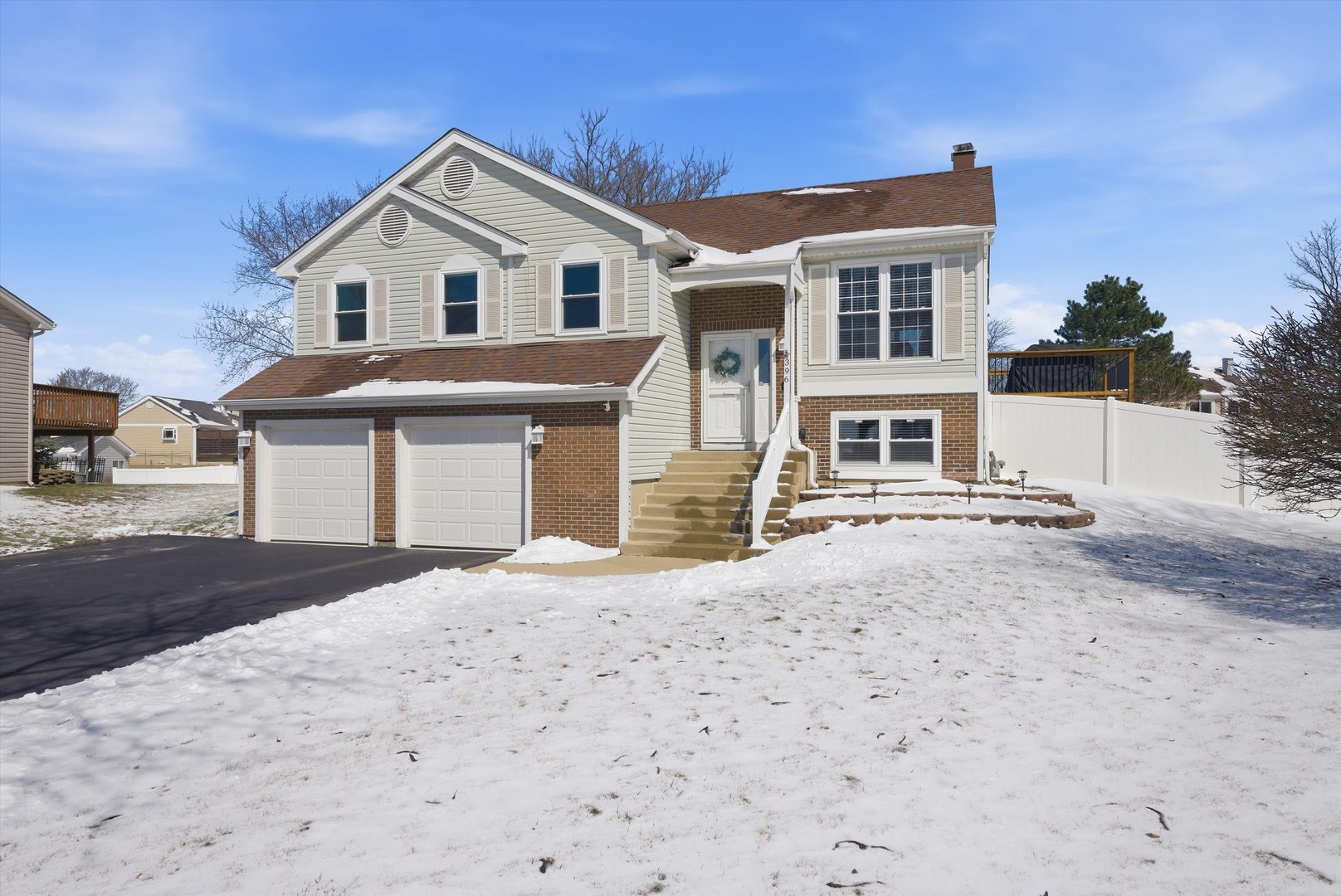 396 Nantucket Court Bartlett, IL 60103 - Photo 2 of 36 a front view of a house with a yard