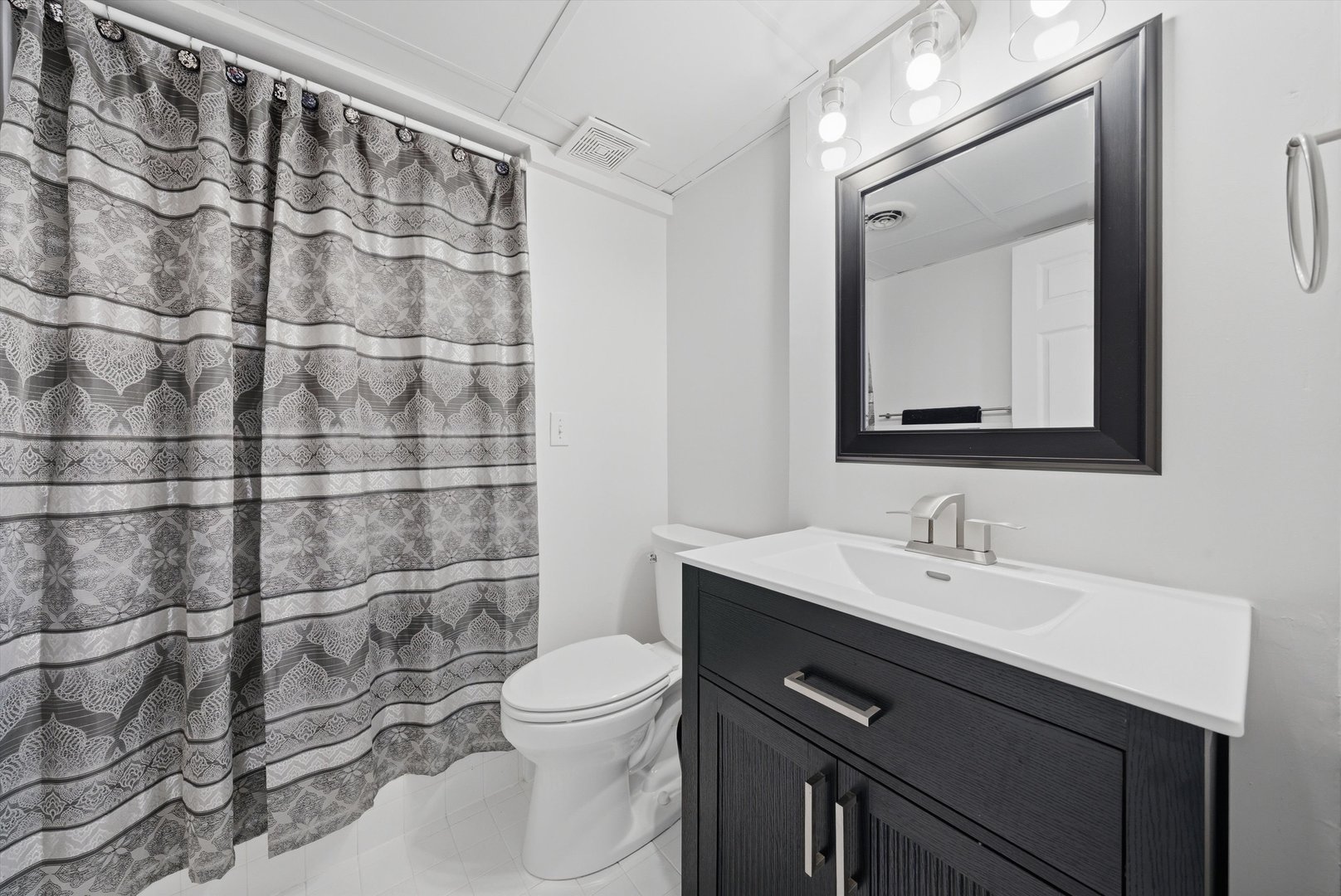 396 Nantucket Court Bartlett, IL 60103 - Photo 26 of 36 a bathroom with a sink mirror toilet and shower