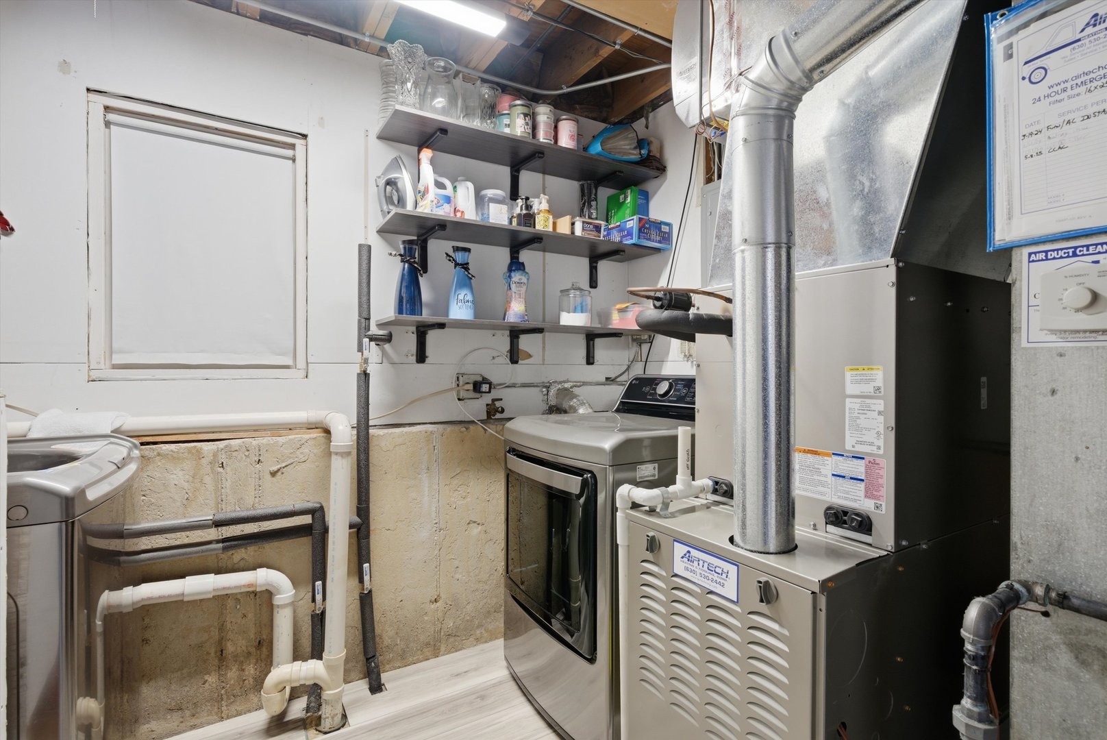396 Nantucket Court Bartlett, IL 60103 - Photo 27 of 36 a view of a storage and utility room with washer and dryer