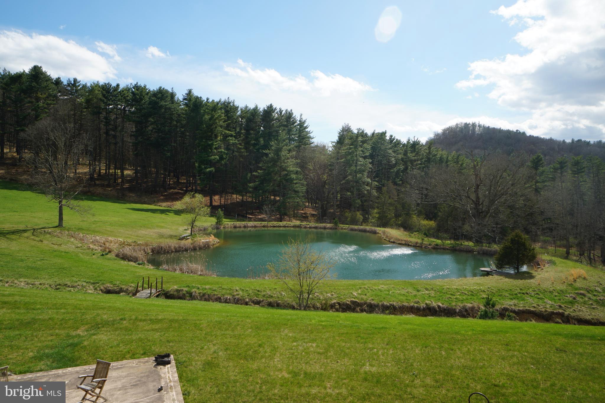 1873 Capito Hill Road Franklin, WV 26807 - Photo 55 of 72 a view of a golf course with a lake view
