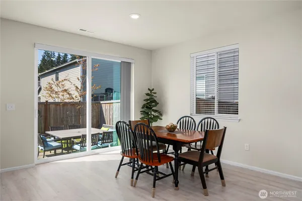 a dining room with furniture and window