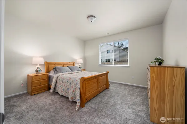 a bed room with a bed and a window