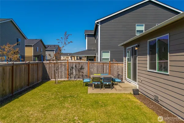 a view of a house with swimming pool in front of it
