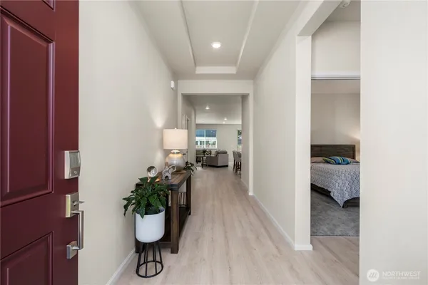 a room with furniture and a potted plant