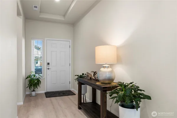 a room with furniture and a potted plant
